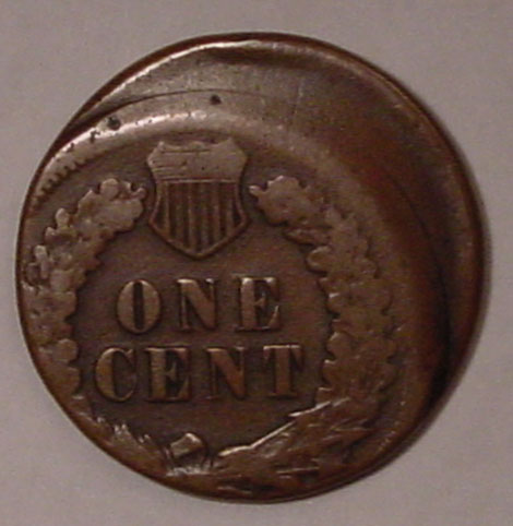 1893 Indian Head Penny off-center strike error showing blank crescent of planchet on one side and the shifted Indian Head design